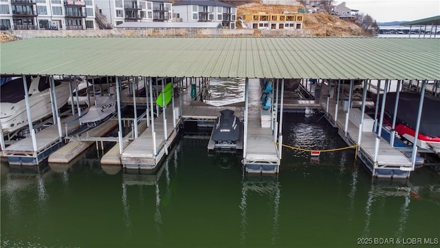 view of dock featuring a water view and boat lift