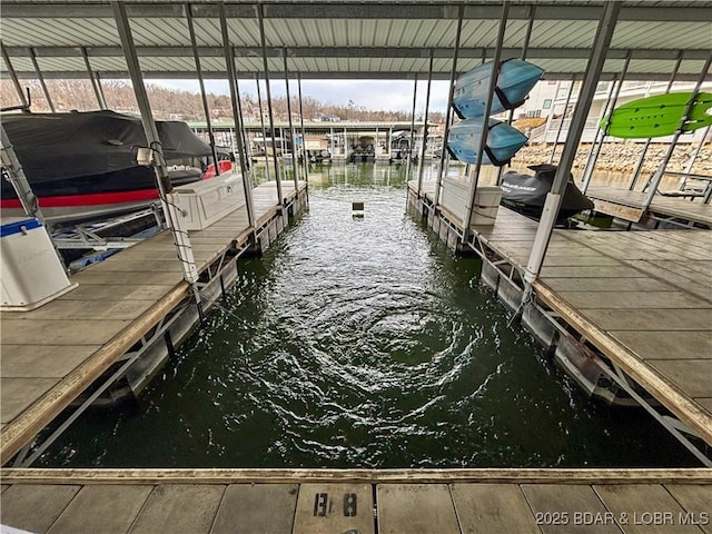 view of dock featuring a water view and boat lift