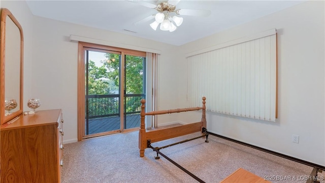 carpeted bedroom with access to outside and ceiling fan
