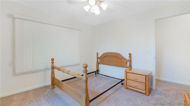 bedroom featuring ceiling fan, carpet, and baseboards