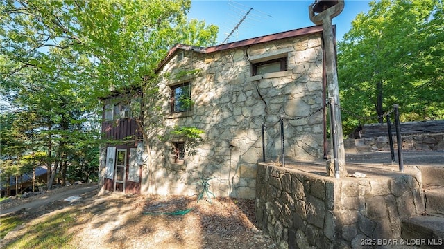 view of property exterior featuring stone siding