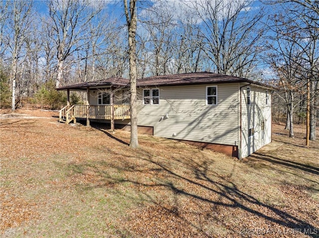 exterior space featuring a wooden deck