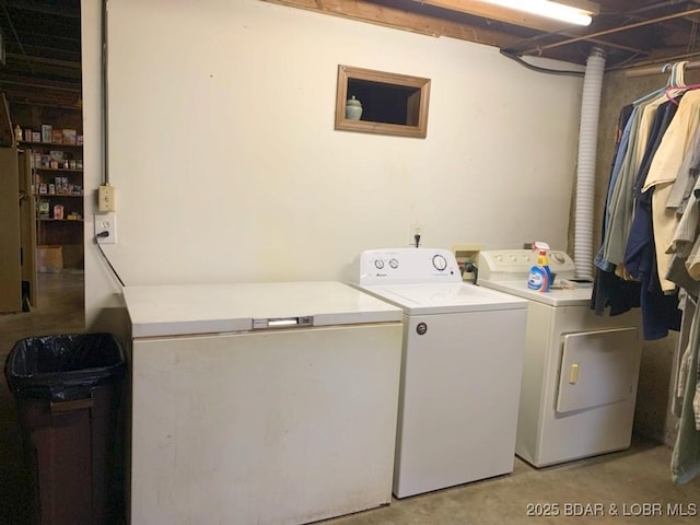 laundry room with laundry area and separate washer and dryer