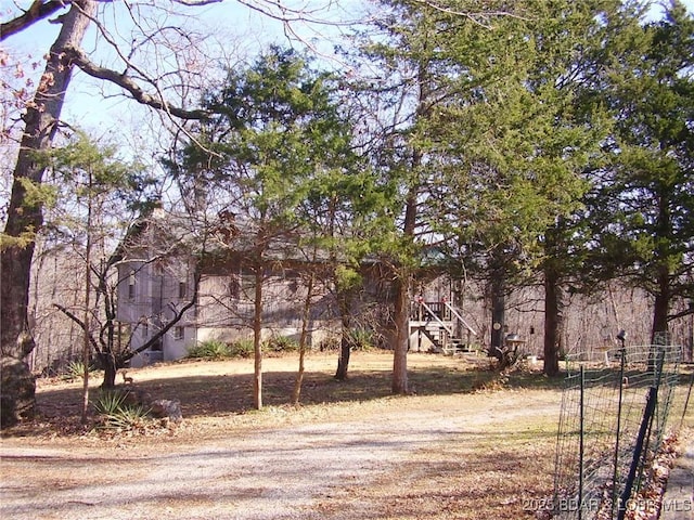 view of yard featuring stairway