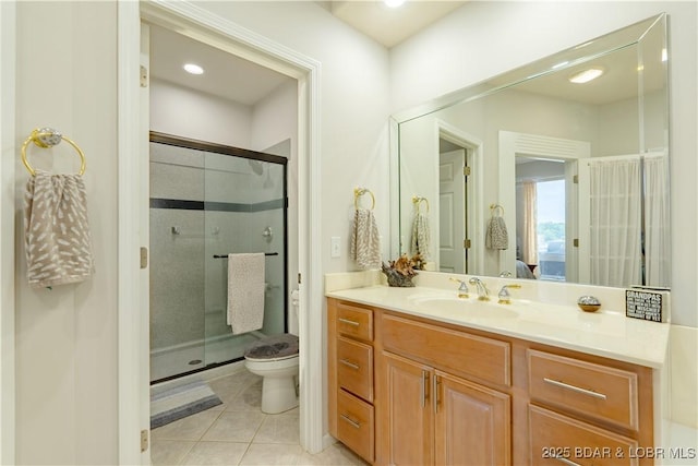 full bath featuring tile patterned flooring, toilet, a shower stall, and vanity