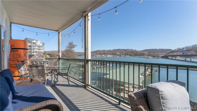 balcony featuring a water view