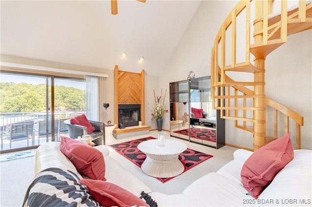 carpeted living area featuring a large fireplace and high vaulted ceiling