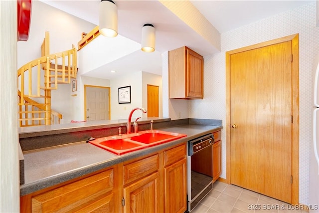 kitchen with black dishwasher, wallpapered walls, a sink, and light tile patterned floors