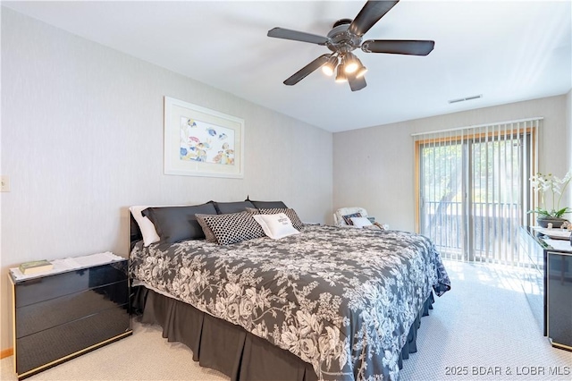 carpeted bedroom with a ceiling fan, visible vents, and access to exterior