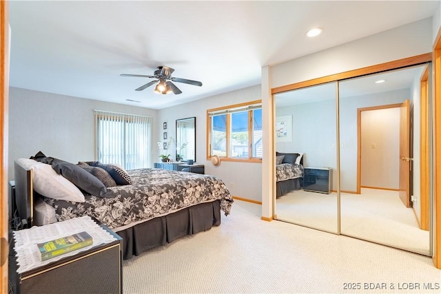 bedroom featuring recessed lighting, carpet floors, a ceiling fan, baseboards, and a closet