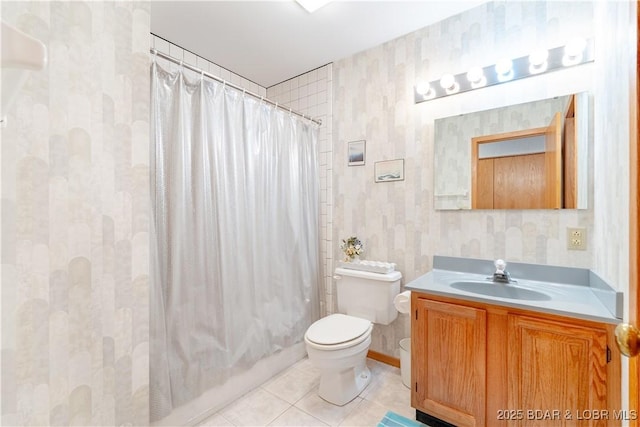 bathroom featuring a shower with shower curtain, toilet, vanity, tile patterned flooring, and wallpapered walls