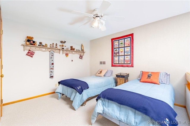 bedroom featuring a ceiling fan, baseboards, visible vents, and carpet flooring