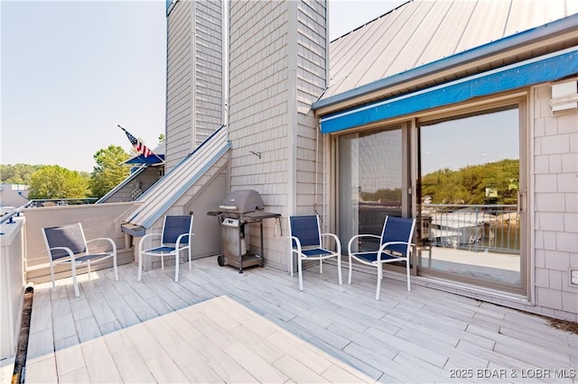 wooden deck featuring grilling area