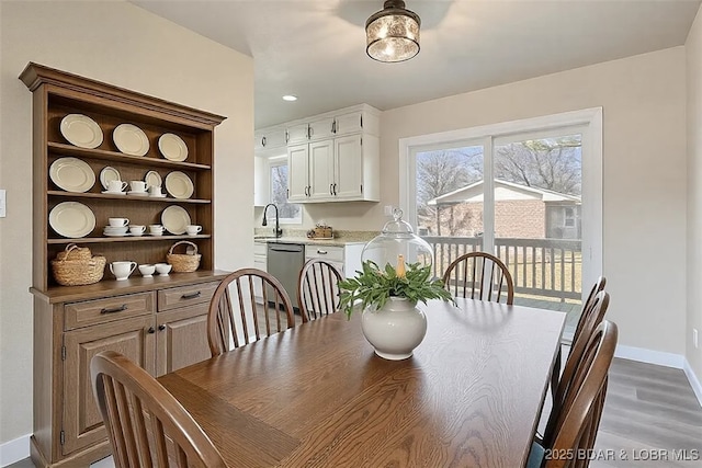 dining space featuring recessed lighting, wood finished floors, and baseboards