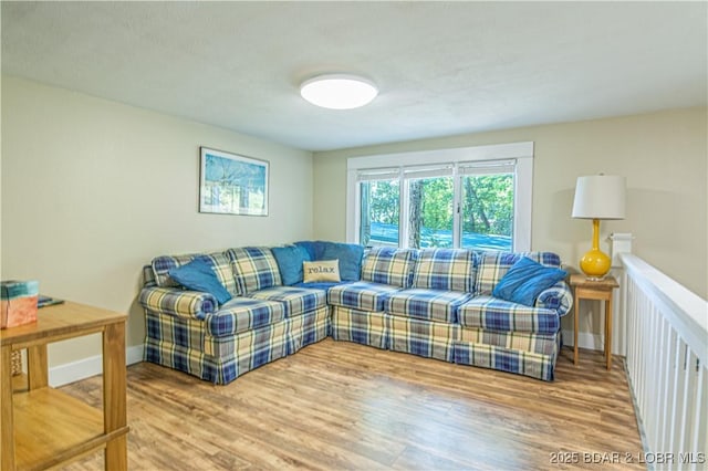 living room featuring baseboards and wood finished floors