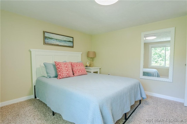 carpeted bedroom with baseboards