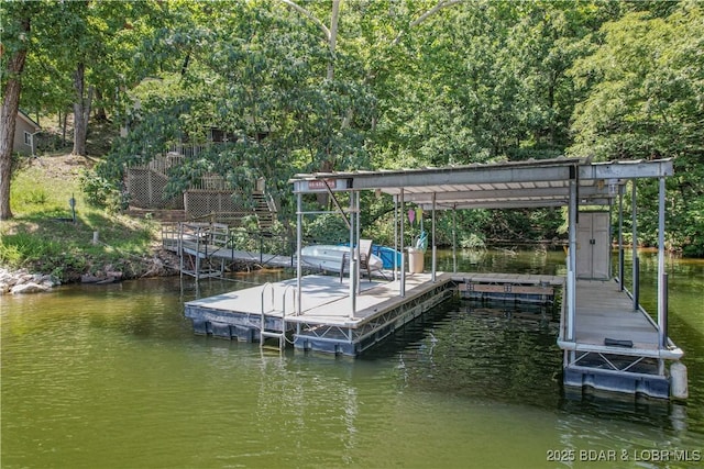 dock area with a water view and stairs