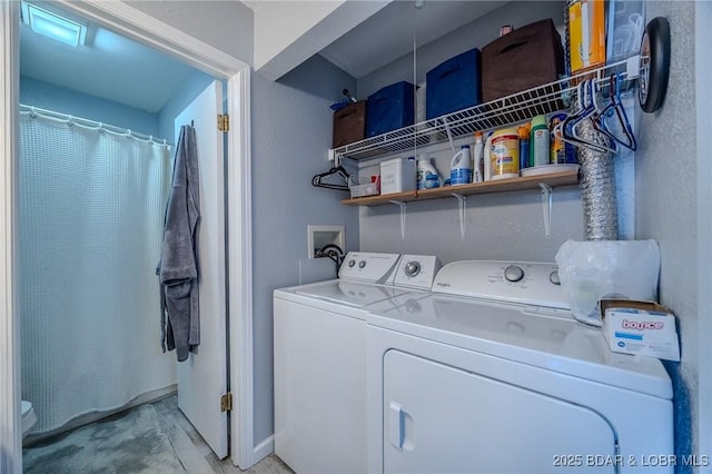 laundry room featuring washer and dryer and laundry area