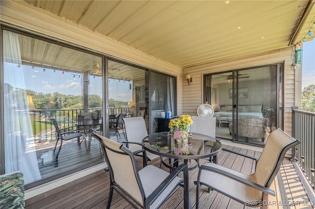 wooden deck with outdoor dining area