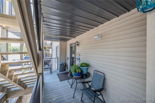 wooden terrace featuring central AC unit