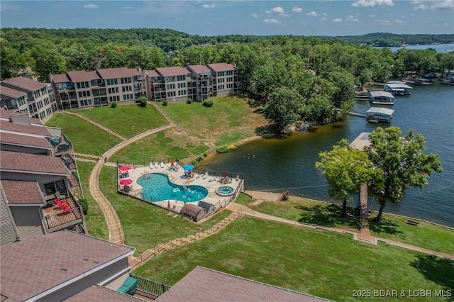 birds eye view of property with a water view