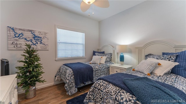 bedroom featuring vaulted ceiling, ceiling fan, wood finished floors, and baseboards