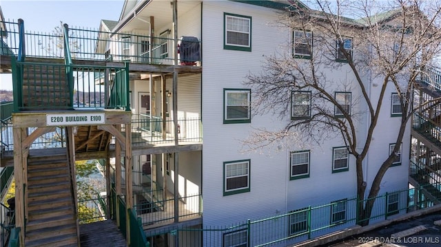 view of side of property with stairs