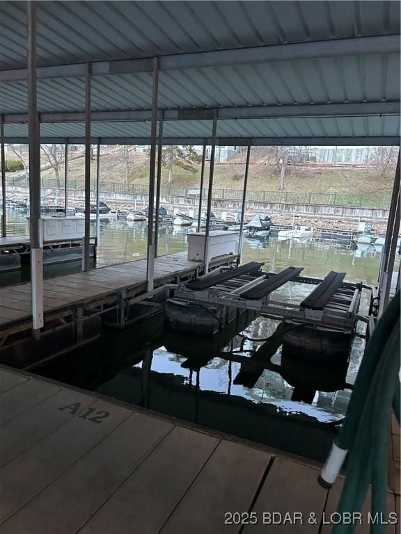 view of dock featuring a water view and boat lift