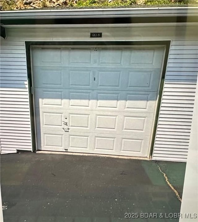 garage featuring driveway