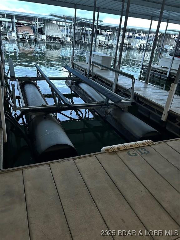 view of dock with a water view and boat lift