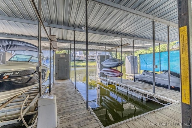 view of dock with a water view and boat lift