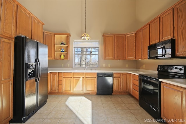 kitchen with black appliances, open shelves, a sink, and light countertops