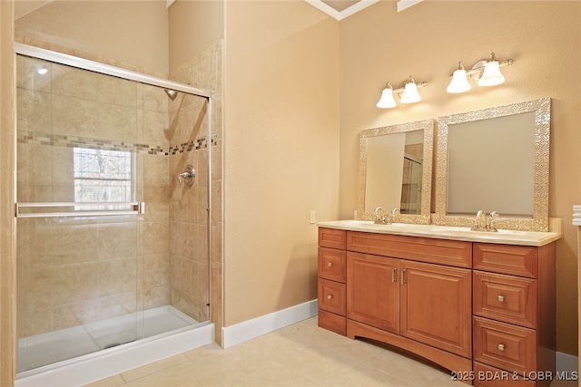 bathroom featuring a sink, a shower stall, and double vanity