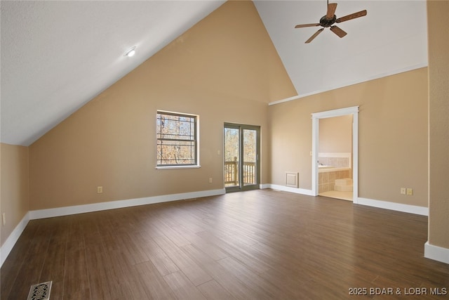 bonus room featuring dark wood-style floors, visible vents, and baseboards