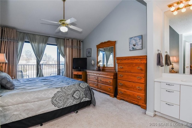 bedroom featuring light colored carpet, access to outside, ceiling fan, a sink, and lofted ceiling