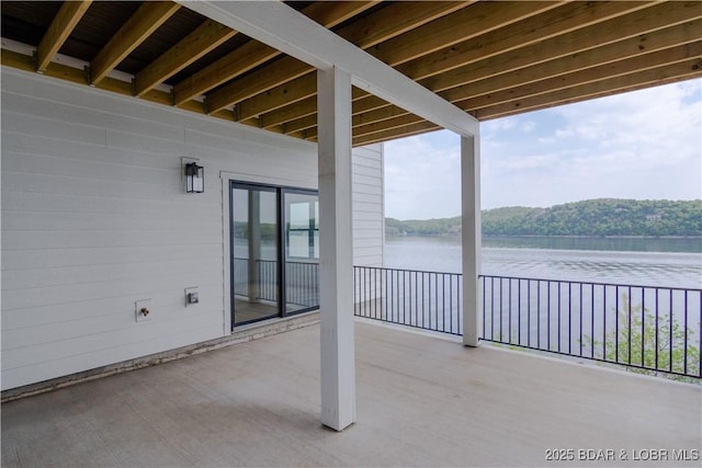 view of patio featuring a water view