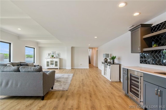 325 Mission Bay Dr, Camdenton, MO 65020 - living room featuring light wood-style floors, recessed lighting, and beverage cooler