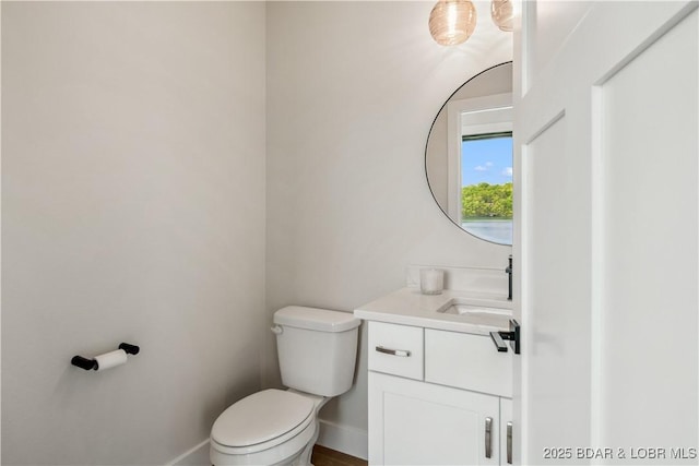 325 Mission Bay Dr, Camdenton, MO 65020 - bathroom with vanity, toilet, and baseboards