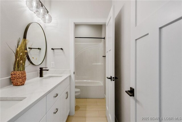 325 Mission Bay Dr, Camdenton, MO 65020 - bathroom featuring a sink, toilet, shower / washtub combination, wood finished floors, and double vanity