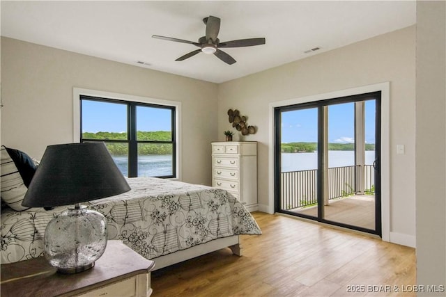 325 Mission Bay Dr, Camdenton, MO 65020 - bedroom with baseboards, light wood finished floors, visible vents, and access to exterior