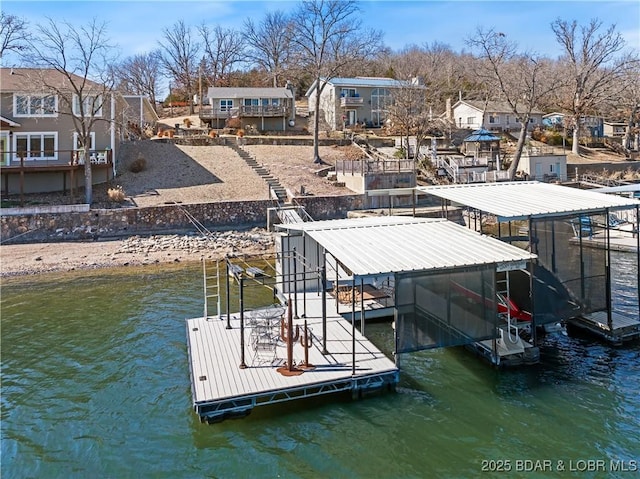 dock area featuring a residential view and a water view