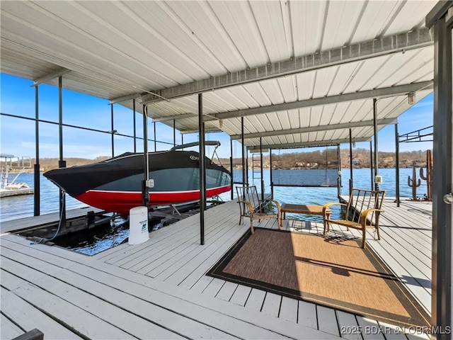 view of dock featuring a water view and boat lift