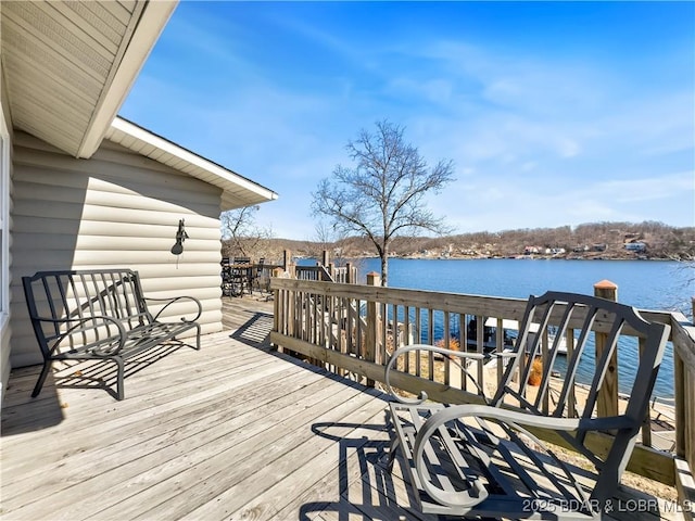 wooden terrace with a water view