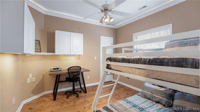 bedroom with baseboards, visible vents, ceiling fan, crown molding, and light wood-type flooring