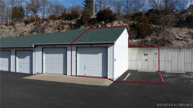 garage with fence