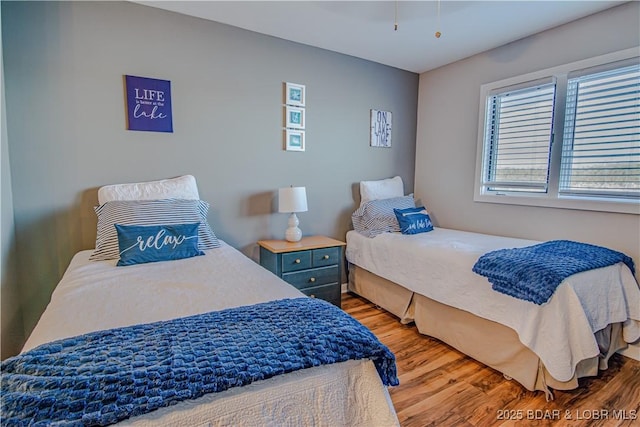 bedroom featuring wood finished floors