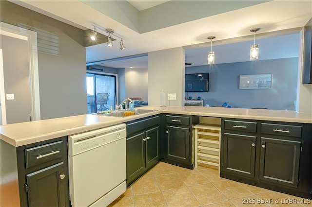 kitchen with light countertops, hanging light fixtures, white dishwasher, a sink, and a peninsula