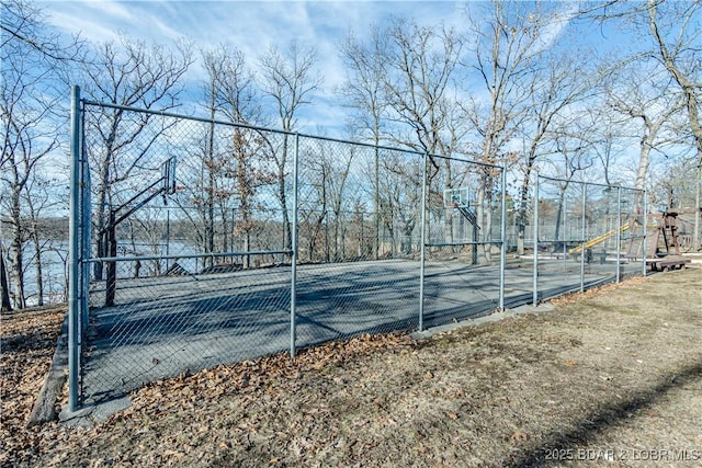 view of sport court featuring community basketball court and fence