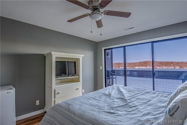 bedroom featuring dark wood-style floors, access to exterior, visible vents, baseboards, and fridge