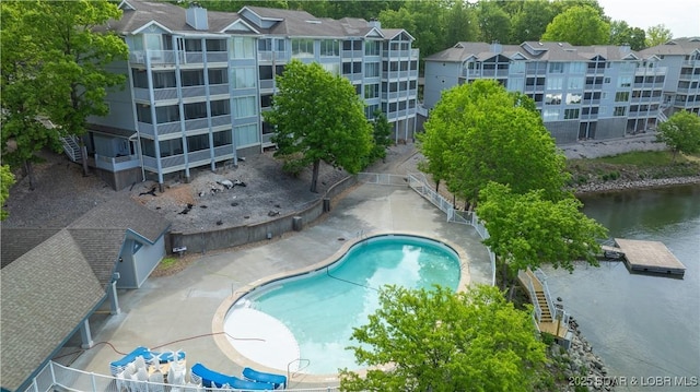 community pool featuring a water view